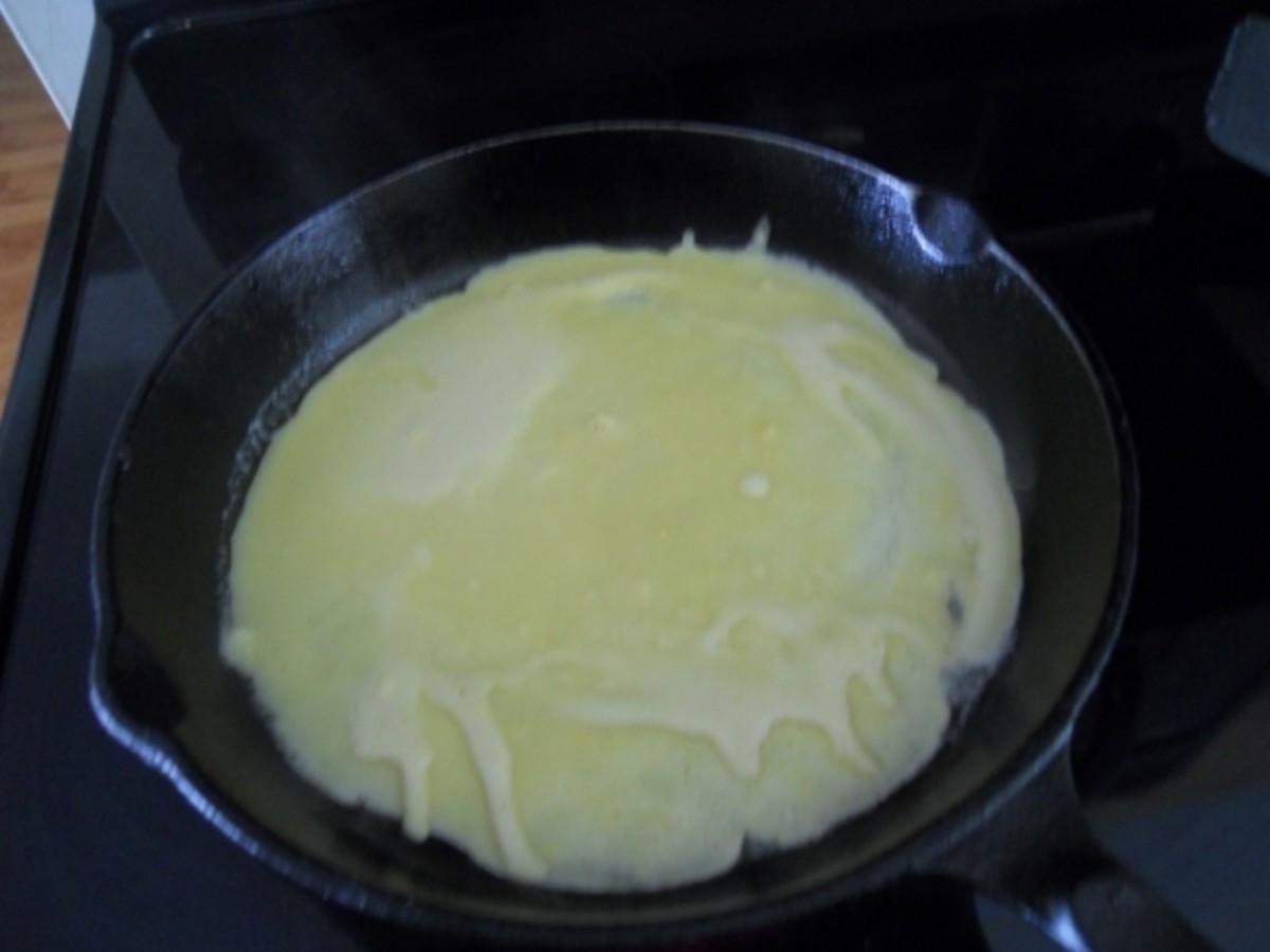 Put a 1/4 cup of batter in a hot buttered pan and rotate the pan until the batter is evenly distributed.