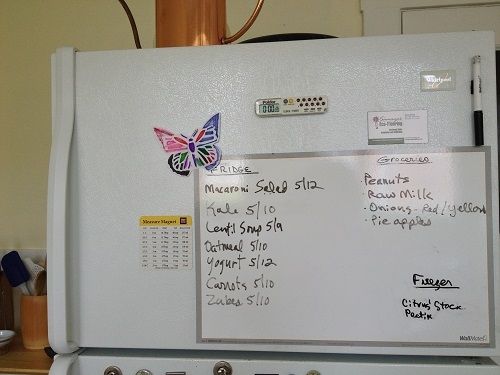Removable Peel-and-Stick Dry-Erase board and marker on our fridge
