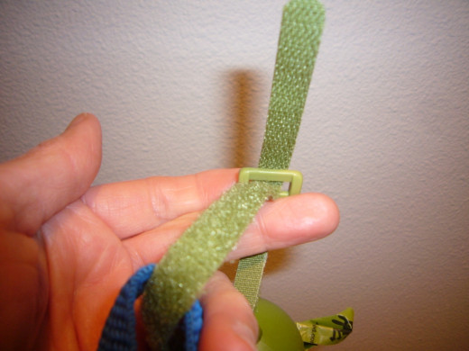 A Velcro loop strap makes it easy to attach to a leash, belt, loop or backpack.