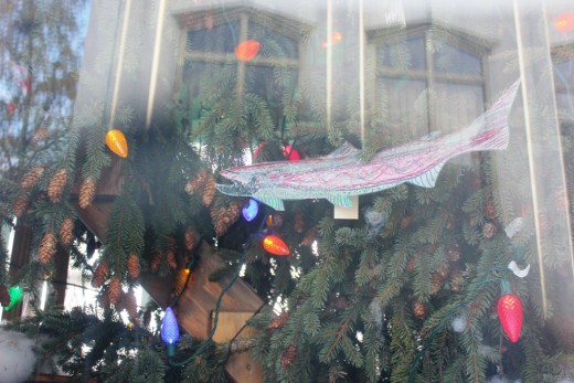 This is a view of some of the handmade ornaments based on the theme "Sharing Washington's Good Nature" including a salmon, an important state species.