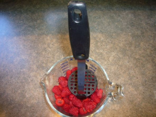 Mash the rinsed berries 1 cup at a time
