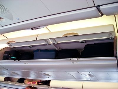 Carry on luggage is becoming heavier. New fees attached to checked luggage mean more stuffed overhead bins.
