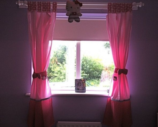 Hello Kitty curtains and uplighter in my daughter's room