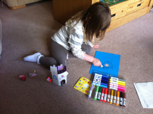 At 3, a love of paper crafts continued (along with the drawing)...