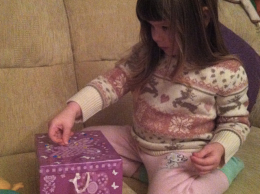 ... and decorating her own items like this sparkle jewelry box kit