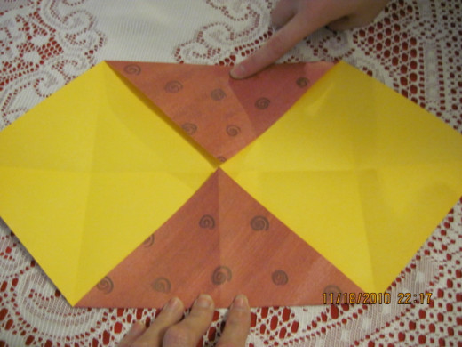 Step 4 fold the other two corners to the center