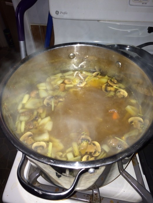 Boiling away: My broth is coming along beautifully. The onion skins give it such a wonderful color. It smells delicious!