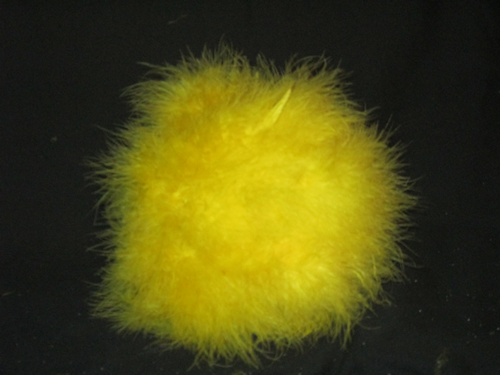 Fluff the feathers around the pins to cover them. Now stick the painted dowel rod into the center of the covered ball.