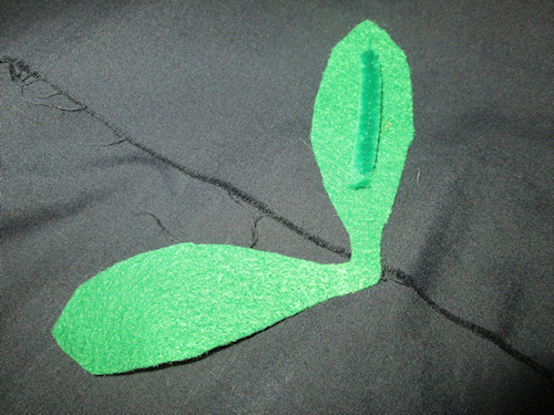 I added a small piece of green pipe cleaner (chenille stick) to the inside of each of the felt leaves so they would hold their shape. I secured it with hot glue.