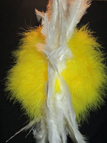 Go back and add another row of feathers to fluff it up. Side view with all the feathers stuck into the foam yellow ball.