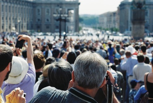 Trying to get a fleeting view of the Pope as he sped by in his "Pope Mobile". (Looking away from the basilica and toward Via della Concillazione.)
