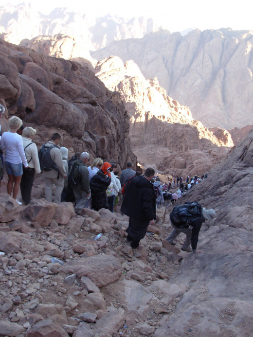 At sunrise people going down the Sinai Mountain back to the foot whre is St. Catherine's Monastery