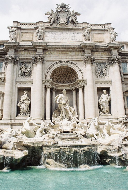 The Trevi Fountain, completed in 1762. It is now an icon, having been featured in such movies as "Three Coins in the Fountain," "La Dolce Vita," and "Roman Holiday." A legend holds that if visitors throw a coin into it, they will return to Rome.