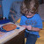 Getting to work on a sticky mosaic picture. Getting to work on a sticky mosaic picture.
