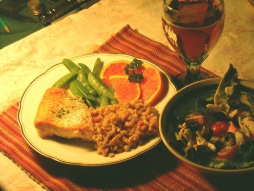 Salmon with barley pilaf, snow peas and oranges.