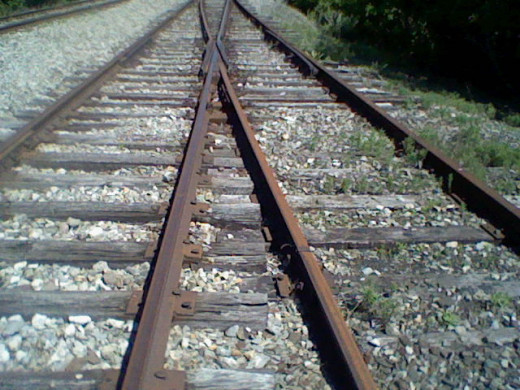 The term they cross in the middle. This is where the two lines can become one and redirect the trains.