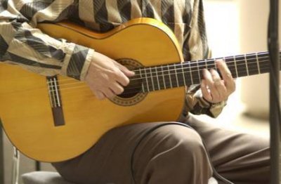 Holding the Guitar