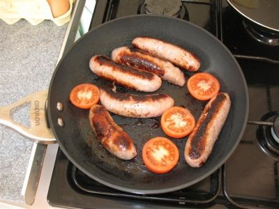Begin with the items that take the longest to cook - Sausages, Bacon, Tomatoes