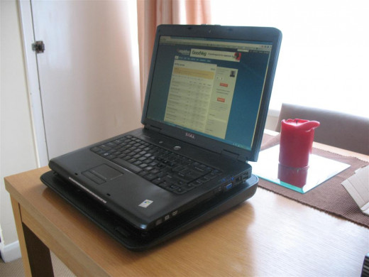 My 15.4" laptop sitting on the Zalman ZM-NC3 laptop cooler. Plenty big enough for a 17" laptop.
