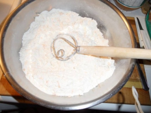 I use a dough whisk for mixing small batches of dough. I also have a set of nesting steel bowls. I can mix dough in the middle bowl and invert the smaller one on top when proof the dough.