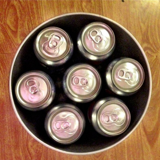 Soda (or beer) is kept in a silver-colored metal wastebasket. Because it's waterproof we can put ice straight in there