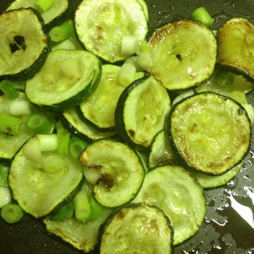 Zucchini, onions and garlic in pan.