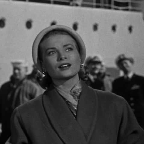 The structured hat and the scarf is typical of the era and her own style.
