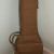 The gig bag is heavy canvas and has some padding and a storage pocket for storing picks and tuners and paper work. The gig bag is heavy canvas and has some padding and a storage pocket for storing picks and tuners and paper work.