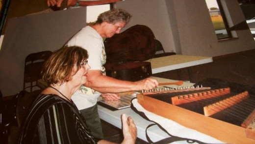 These ladies love to play the auto harp. Everyone takes a turn at it.