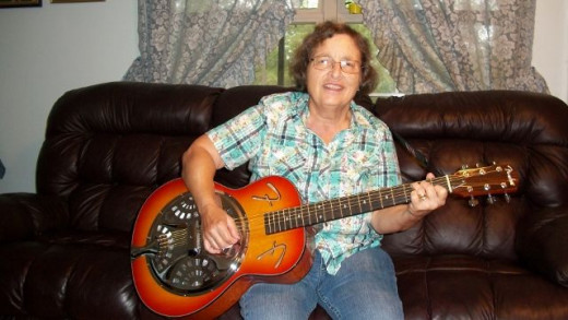 Me with My Fender Resonator guitar. I really like to bring this guitar to class as it is really loud enough for everyone to hear. This is fun.