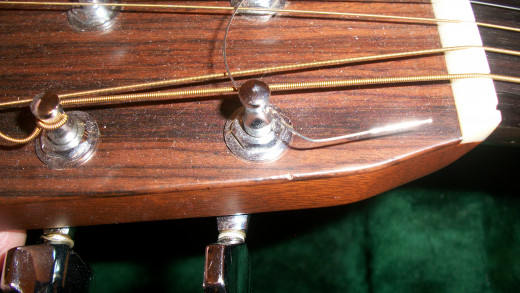 The string goes through the hole