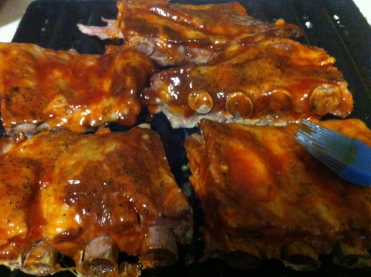 Slather the ribs in BBQ sauce making sure to cover them well with the sauce. Pop under the broiler for 5-10 minutes.