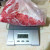 Weighing a pkg of ground beef. Weighing a pkg of ground beef.