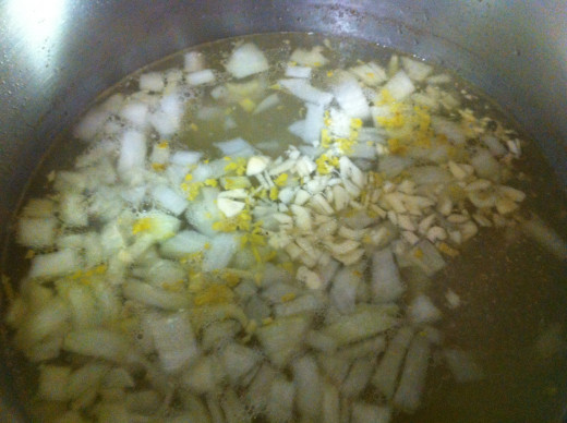Adding the veggies to the broth.