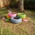 I spray painted and stacked tires with smaller ones on top and used old deli trays to close the bottom. Filled with soil they keep my plants warm. I spray painted and stacked tires with smaller ones on top and used old deli trays to close the bottom. Filled with soil they keep my plants warm.