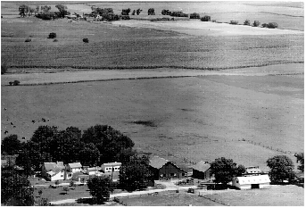 Aerial photo of the farm, old barn near center, late 1940s