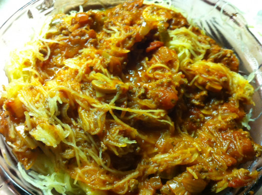 Pour spaghetti sauce over the squash, serve, and enjoy.