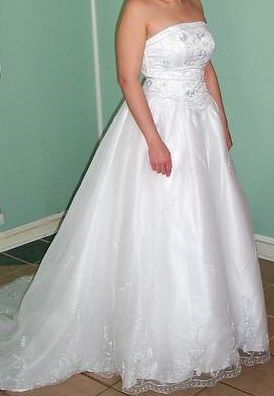 A-line dresses draw the eye upward and shrink the waistline