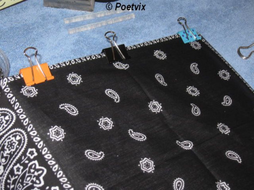 When you determine where you want it positioned, use the bulldog clips to secure it. They work kind of like pins would if we were sewing, but leave no holes. When you clip it, be sure not only the top edge is lined up like you want it, but the sides 