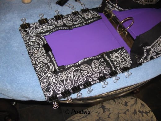 Now, fold over the tops and clip them so it looks just like you want it before gluing. When you're happy with it, use the same method as before and glue it all down. Repeat for the other side. Remember, where there are more fabric layers, it takes mo
