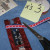 Cut three strips of ribbon to wrap around the bookmark, two for the top and one for the bottom. Cut three strips of ribbon to wrap around the bookmark, two for the top and one for the bottom.