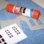 Glue the red film behind the windows and doors. Glue them behind the walls. Glue the end of the walls together. Glue the red film behind the windows and doors. Glue them behind the walls. Glue the end of the walls together.