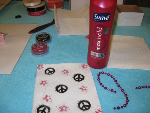 TRICK - Spray the napkins with hair spray immediately after stamping to seal the ink. Doing this step will ensure your ink doesn't run when glued. TRICK - Spray the napkins with hair spray immediately after stamping to seal the ink. Doing this step will ensure your ink doesn't run when glued.