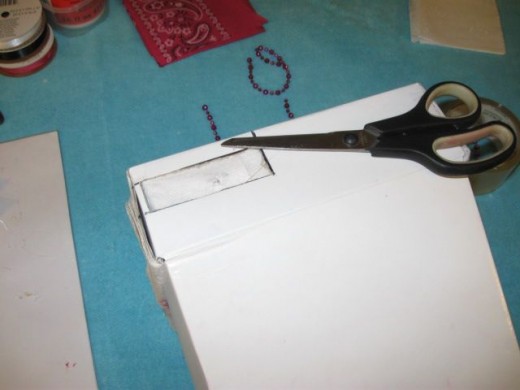 Be sure to cut and fold over the lining in the back where you cut a hole for the electrical cords. Be sure to cut and fold over the lining in the back where you cut a hole for the electrical cords.