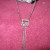 Run the chains through some ribbon and a button for each side. Glue the embellishments to the purse in desired places. Run the chains through some ribbon and a button for each side. Glue the embellishments to the purse in desired places.