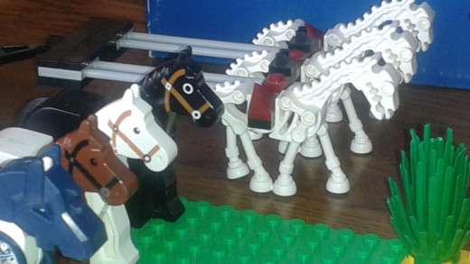 Lego Horses.  One with armor, 3 skeletons, and 3 normal horses.