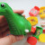 This photo shows the playing pieces (in 4 different colors - one color for each player), the dice and of course the wind-up dinosaur toy. This photo shows the playing pieces (in 4 different colors - one color for each player), the dice and of course the wind-up dinosaur toy.