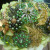 Vintage green brooches make up this brooch bouquet by estherleejewelry on Etsy. See the link below.