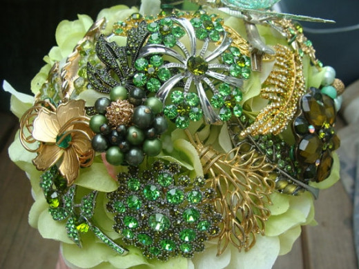 Vintage green brooches make up this brooch bouquet by estherleejewelry on Etsy. See the link below.