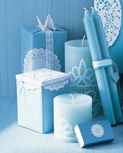 Use lacy doilies to decorate candles. Source: MarthaStewart.com. See link below for directions.